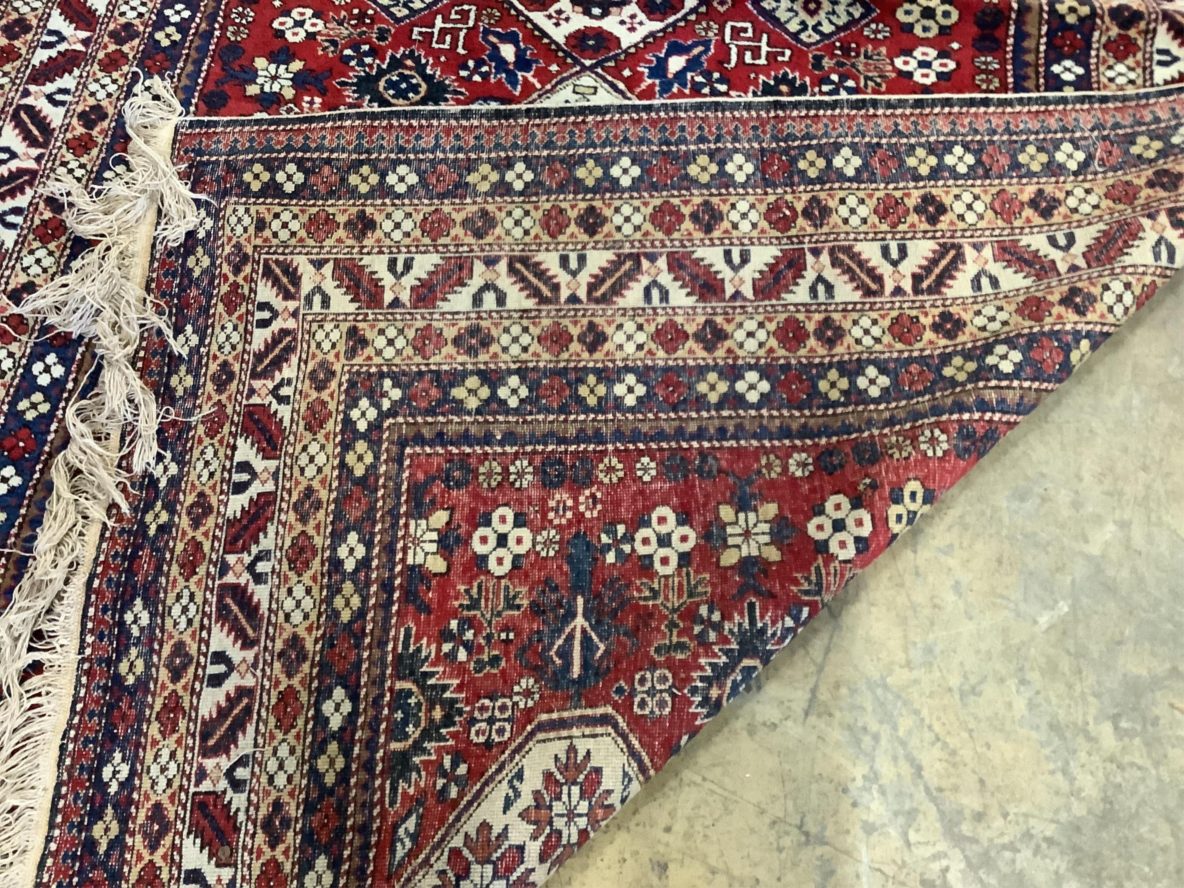 A Kazak red ground rug, 280 x 163cm. Condition - good